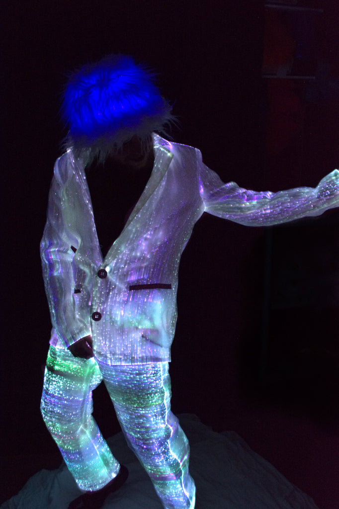 LED fiber-optic light-up jacket, person wearing a glowing fiber-optic outfit lit up in the dark