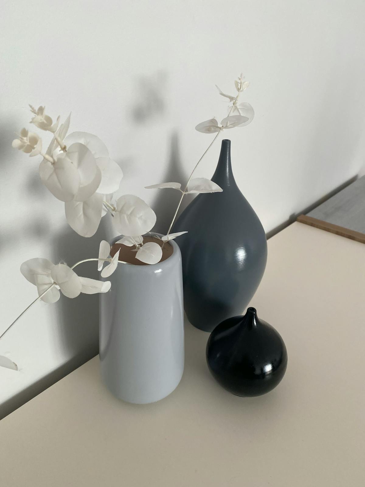 Minimalist Ceramic Vase Set in white on modern shelf