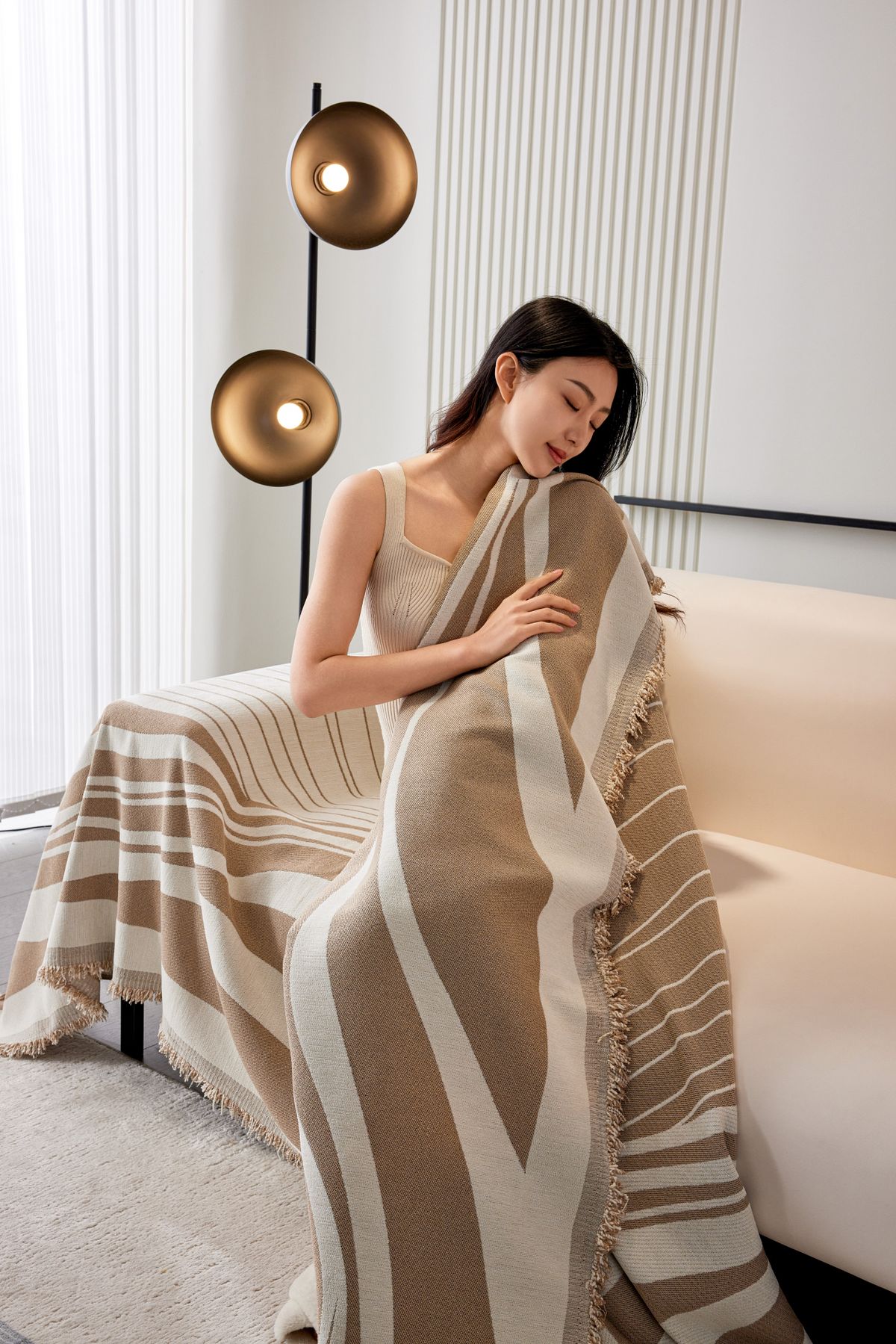 Heated Sherpa Throw Blanket draped over cozy sofa