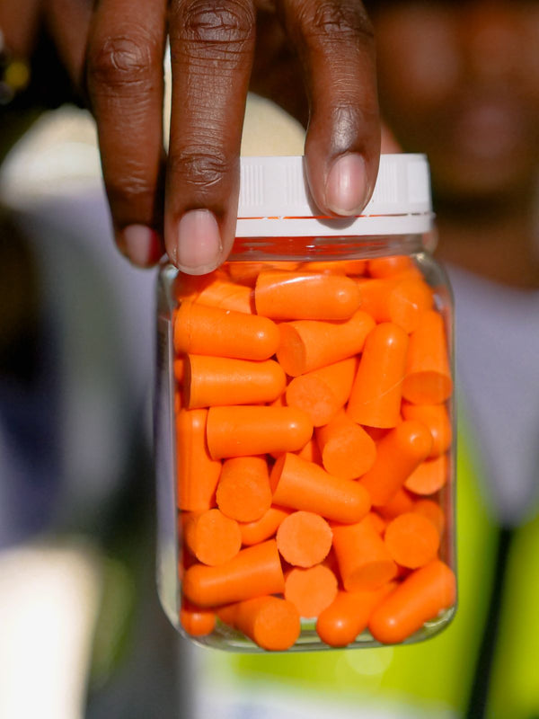 Reusable ear protection plugs in a clear carry jar